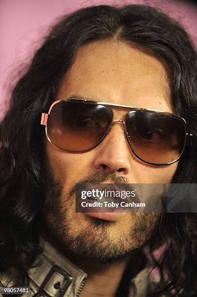 Russell Brand poses for a picture at the 15th Anniversary of Victoria's Secret SWIM catalogue held at Trousdale on March 25, 2010 in Los Angeles,...