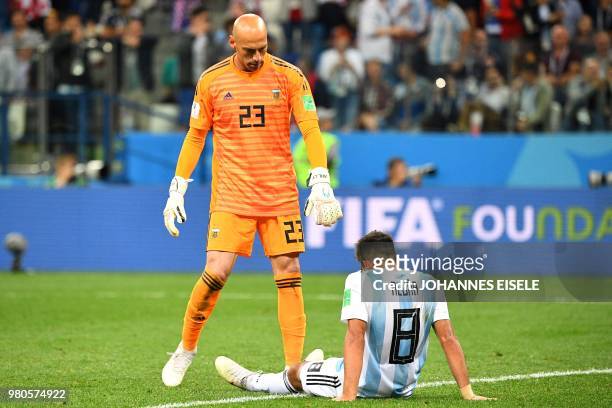 Argentina's goalkeeper Willy Caballero and Argentina's defender Marcos Acuna react after Croatia scored their third goal during the Russia 2018 World...