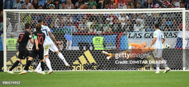 Croatia's midfielder Luka Modric scores their second goal during the Russia 2018 World Cup Group D football match between Argentina and Croatia at...