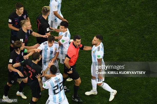 Argentina's defender Nicolas Otamendi argues with Uzbek referee Ravshan Irmatov after a fault on Croatia's midfielder Ivan Rakitic during the Russia...