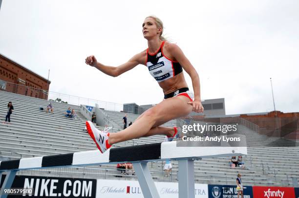 Emma Coburn clears a hurdle in the opening round of the Women 3,000 Meter Steeplechase at the 2018 USATF Outdoor Championships at Drake Stadium on...