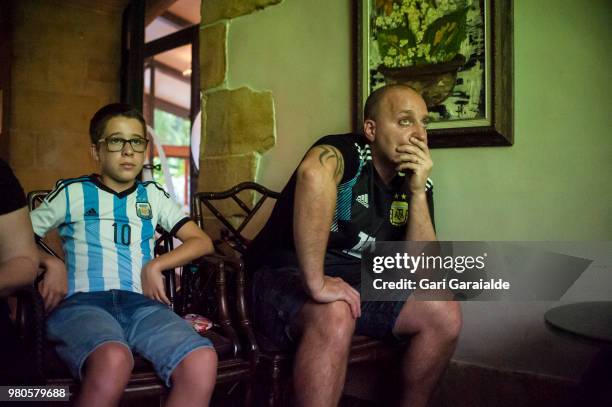 Argentinian football fans watch their national team's Russia 2018 World Cup Group D match against Croatia in a bar on June 21, 2018 in Irun, Spain.