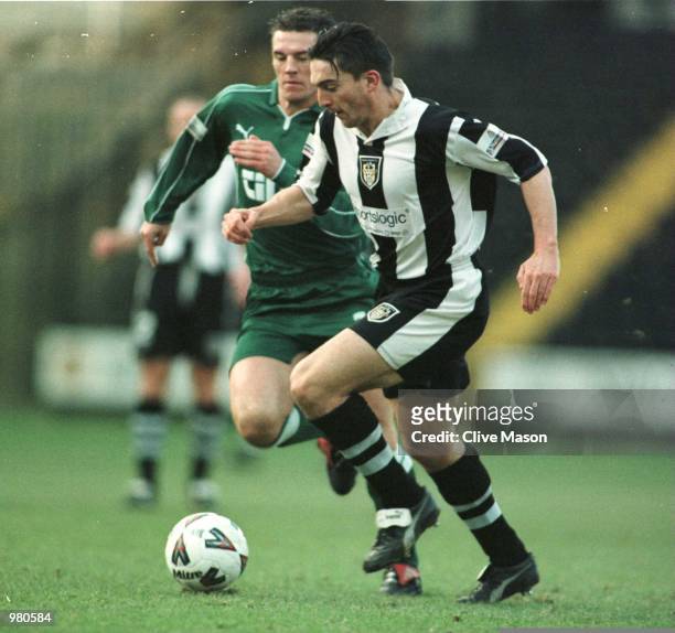 Mark Stallard of Notts County breaks away from Wimbledon's Mark Williams during the AXA sponsored FA Cup Third Round Replay match between Notts...