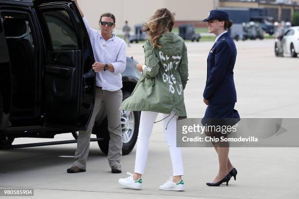 First lady Melania Trump climbs back into her motorcade after traveling to Texas to visit facilities that house and care for children taken from...