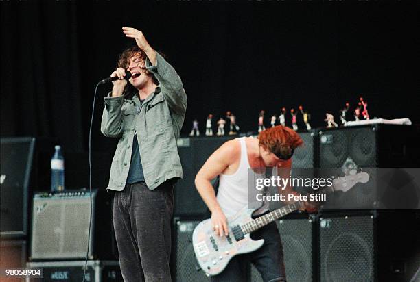 Eddie Vedder and Jeff Ament of Pearl Jam perform on stage in Finsbury Park on July 11th, 1993 in London, England.