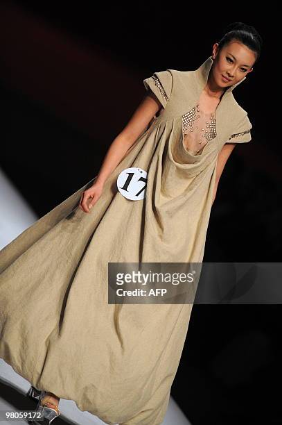 Model presents a creation from the opening ceremony of China Fashion Week Autumn/Winter 2010-2011 and the Hempei Award for the 18th International...