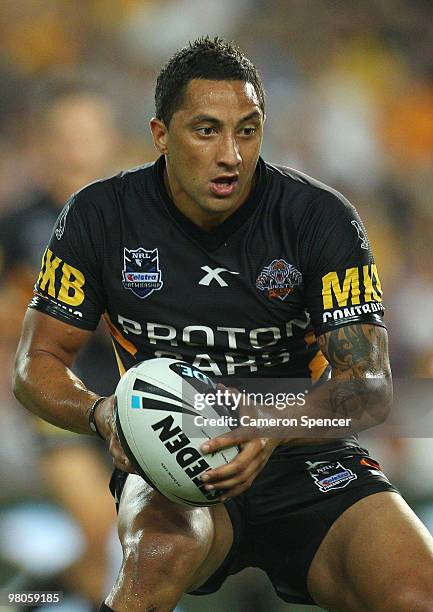 Benji Marshall of the Tigers runs the ball during the round three NRL match between the West Tigers and the Parramatta Eels at Sydney Football...