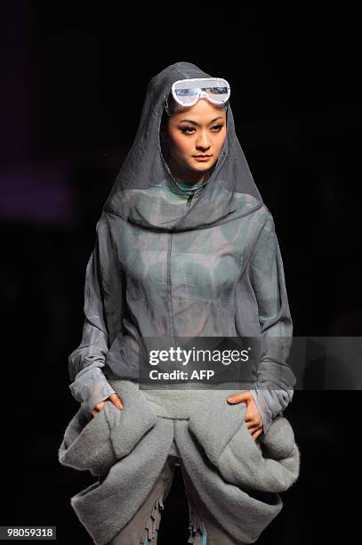 Model presents a creation from the opening ceremony of China Fashion Week Autumn/Winter 2010-2011 and the Hempei Award for the 18th International...