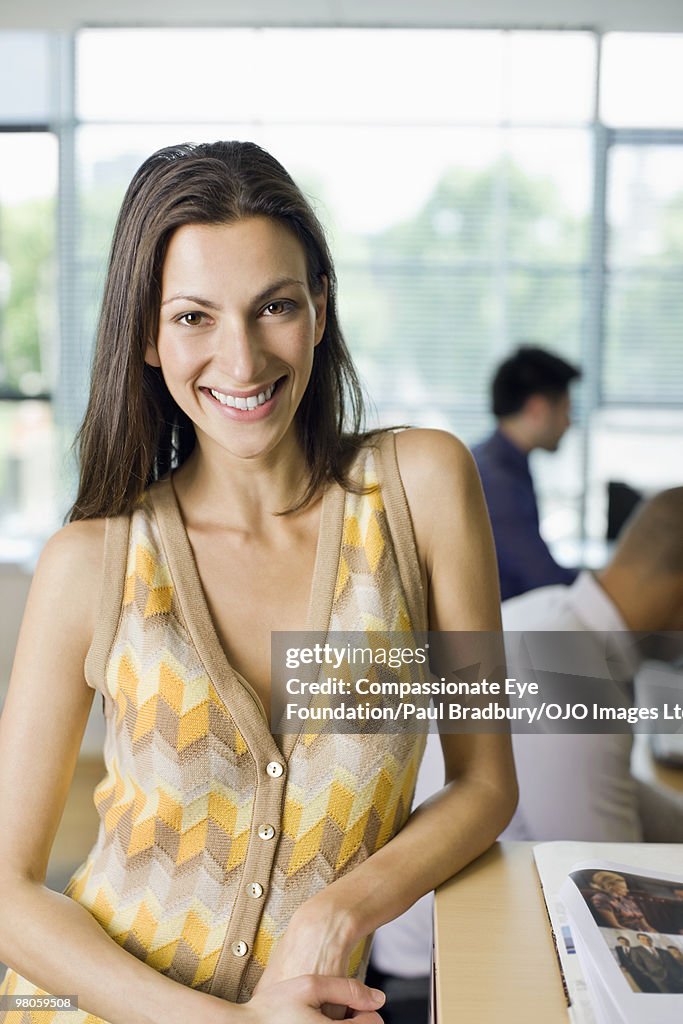 Smiling woman in office environment