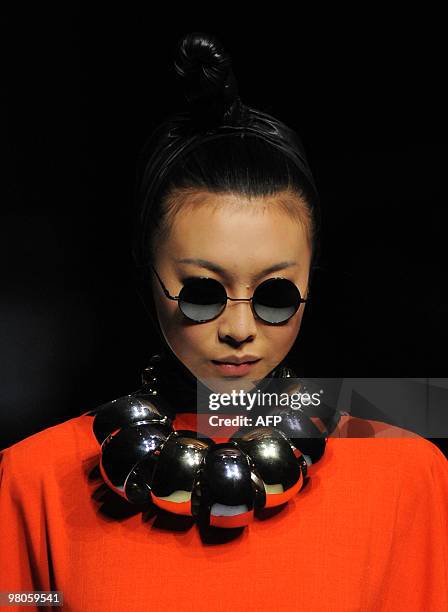 Model presents a creation from the opening ceremony of China Fashion Week Autumn/Winter 2010-2011 and the Hempei Award for the 18th International...