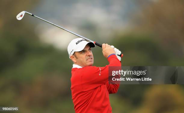 Paul McGinley of Ireland plays his second shot into the eighth green during the second round of the Open de Andalucia 2010 at Parador de Malaga Golf...