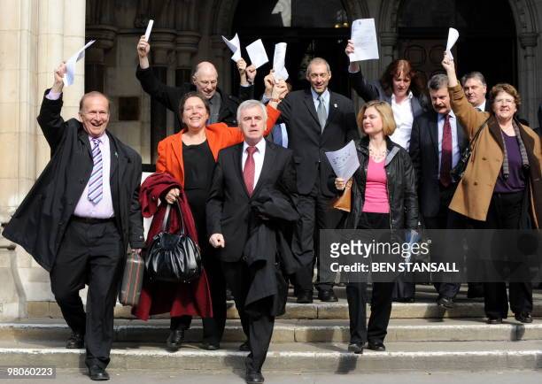 British Liberal Democrat MP Susan Kramer, Labour MP John McDonnell and Conservative MP Justine Greening celebrate as they leave the High Court in...