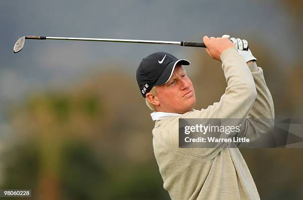 Richard Finch of England plays his second shot into the eighth green during the second round of the Open de Andalucia 2010 at Parador de Malaga Golf...