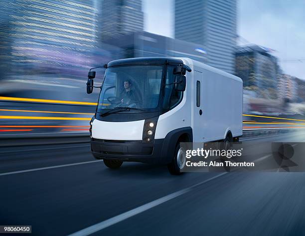 electric van in city - electric vehicle stock pictures, royalty-free photos & images