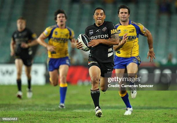 Benji Marshall of the Tigers makes a break during the round three NRL match between the West Tigers and the Parramatta Eels at Sydney Football...