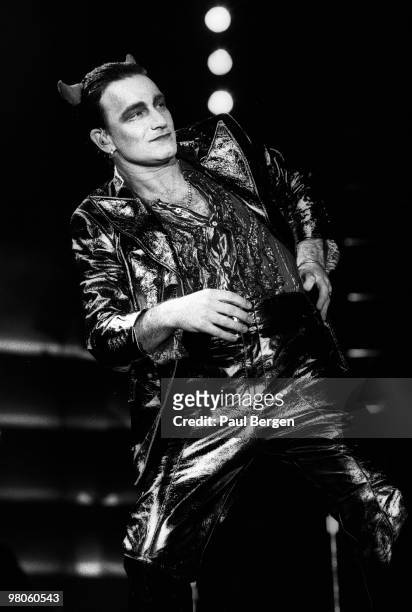 Bono of U2 performs on stage on the Zooropa Tour at Kuip on May 10th 1993 in Rotterdam, Netherlands. He is dressed as MacPhisto character.