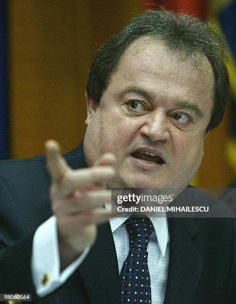 Romanian Internal Affairs minister, Vasile Blaga, gestures during a press conference at the Ministry of Internal Affairs in Bucharest, on June 15,...