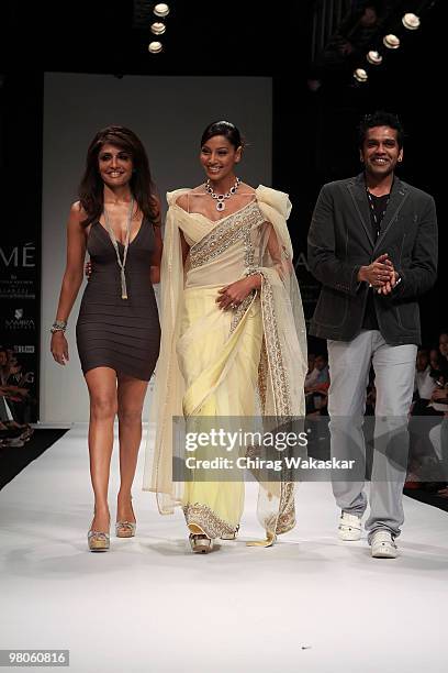Indian actress Bipasha Basu walks the runway in an Giantti design along with fashion designers Queenie & Rocky S at the Lakme India Fashion Week Day...