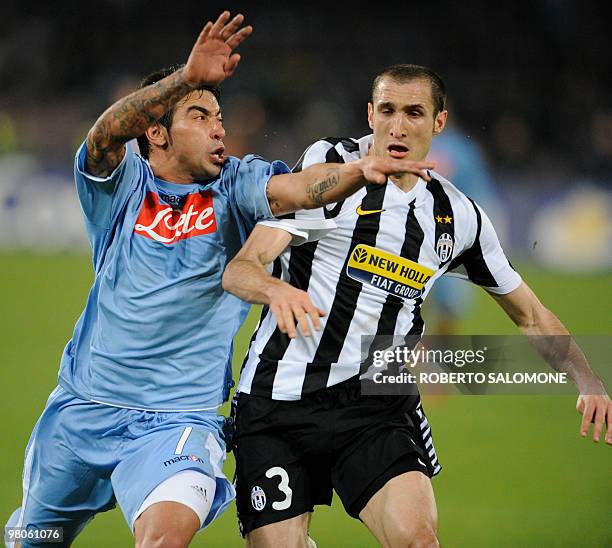 Juventus Giorgio Chiellini fights for the ball with SSC Napoli Ezequiel Lavezzi during their Serie A football match SSC Napoli vs Juventus at San...