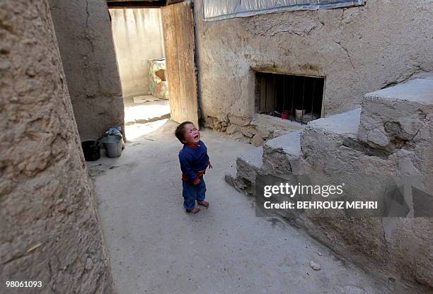 An Afghan boy cries after receiving the polio vaccine on the second day of a vaccination campaign in Kabul on March 15, 2010. A three-day nationwide...