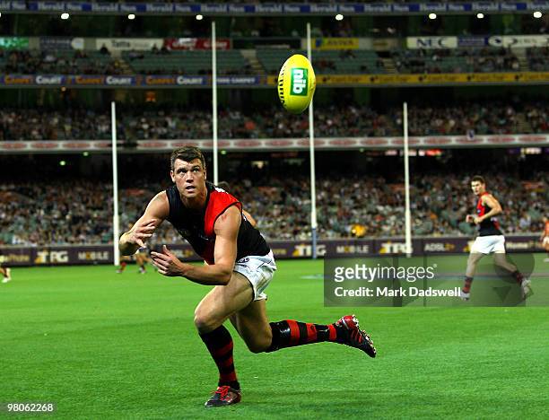 David Hille of the Bombers dives for a mark during the round one AFL match between the Geelong Cats and the Essendon Bombers at Melbourne Cricket...