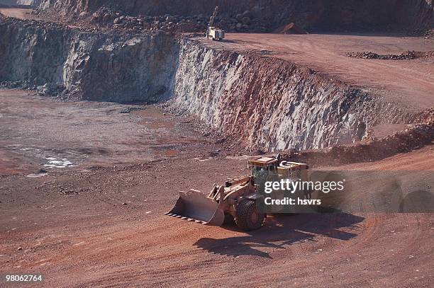 open-pit mine with earth mover - open pit mine bildbanksfoton och bilder