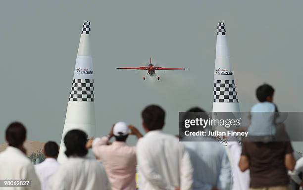 Fas watch Pete McLeod of Canada during the Red Bull Air Race Qualifying session on March 26, 2010 in Abu Dhabi, United Arab Emirates.