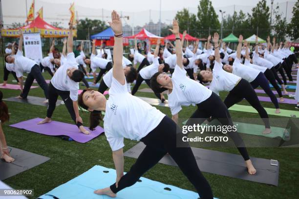 On June 21 local yoga lovers in binzhou city, shandong province, China, held a night yoga activity together.PHOTOGRAPH BY Costfoto / Future Publishing