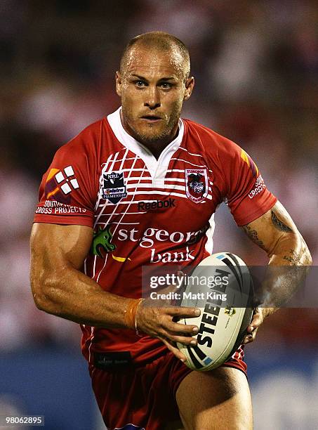 Matt Cooper of the Dragons runs with the ball during the round three NRL match between the St George Dragons and the North Queensland Cowboys at WIN...