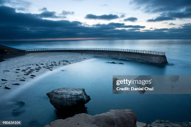 clouds over blue sea at dusk, la jolla, san diego, california, usa - la jolla stock-fotos und bilder