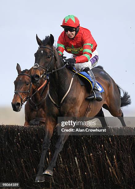 Carlitos ridden by jockey Paddy Brennan clear the last, to win The Wise Catering Ltd Handicap Steeple Chase at Newbury racecourse on March 26, 2010...