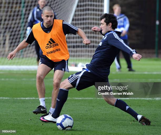 Joe Cole and Yury Zhirkov of Chelsea during a training session at the Cobham training ground on March 26, 2010 in Cobham, England.