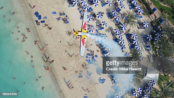 Peter Besenyei of Hungary in action over the beach during the Red Bull Air Race Qualifying session on March 26, 2010 in Abu Dhabi, United Arab...