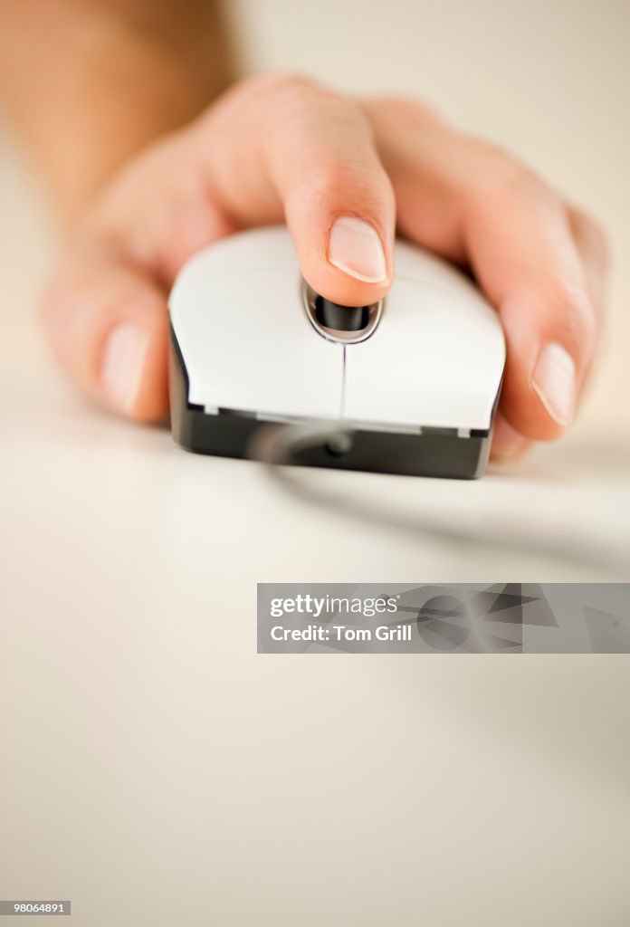 Hand On White Computer Mouse High-Res Stock Photo - Getty Images