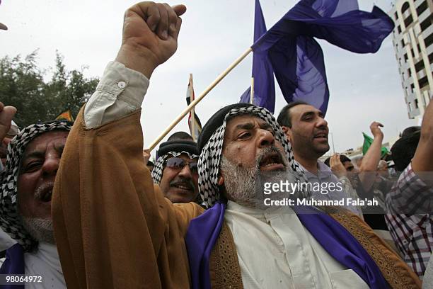 Supporters of Iraqi Incumbent Prime Minister Nouri al-Maliki chant anti-Baathist slogans during a protest on March 26, 2010 in Baghdad, Iraq....