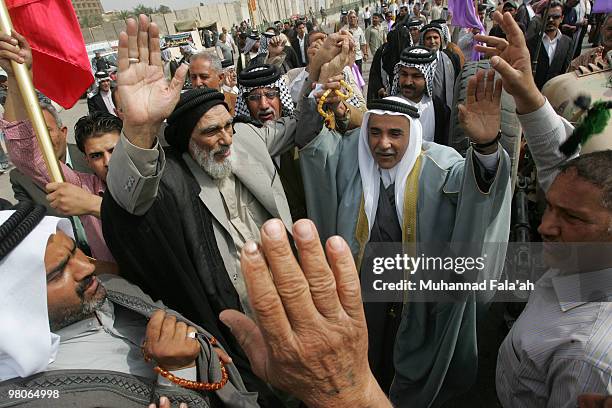 Supporters of Iraqi Incumbent Prime Minister Nouri al-Maliki chant anti-Baathist slogans during a protest on March 26, 2010 in Baghdad, Iraq....