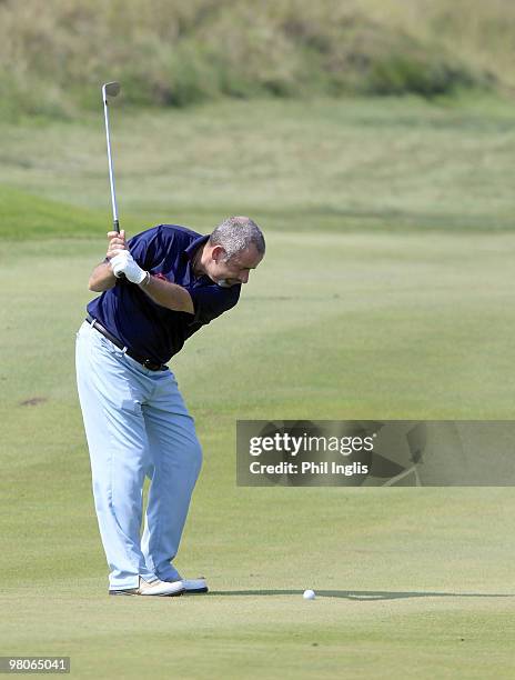 Sam Torrance of Scotland in action during the first round of the Berenberg Bank Masters played over The Links at Fancourt on March 26, 2010 in...