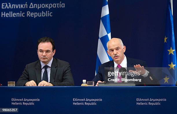 George Papandreou, Greece's prime minister, right, speaks as George Papaconstantinou, Greece's finance minister, listens during a press conference...