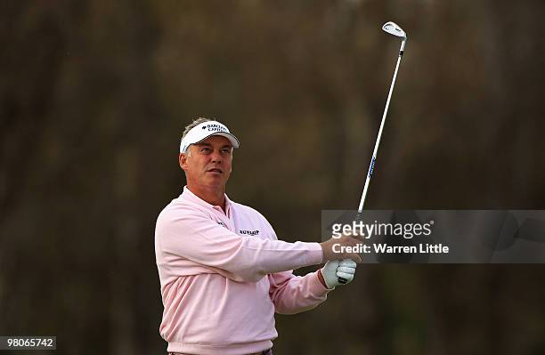 Darren Clarke of Northern Ireland plays his second shot into the seventh green during the second round of the Open de Andalucia 2010 at Parador de...