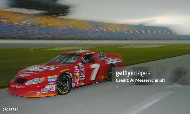 Todd Szegedy drives through the pits as storms darken the skies during qualifying Friday, July 9, 2004 for the NASCAR Busch Series Tropicana Twister...