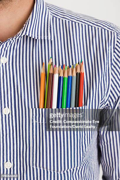 colored pencils in a shirt pocket - david leahy studio stock pictures, royalty-free photos & images