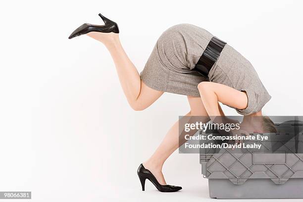 woman in dress and heels falling into container - david leahy studio stock pictures, royalty-free photos & images