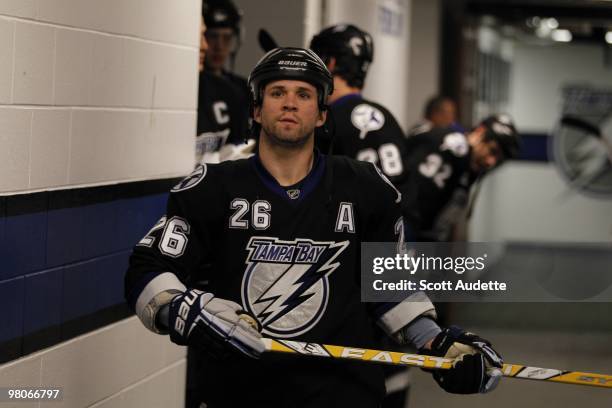 Martin St. Louis of the Tampa Bay Lightning heads to heads ice before the start of the game against the Carolina Hurricanes at the St. Pete Times...