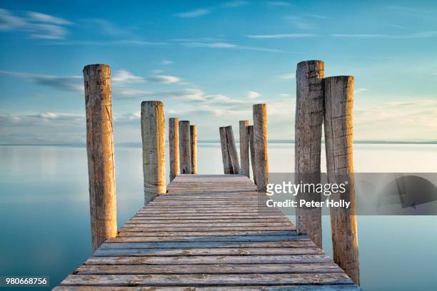 a jetty. - wood pier stock pictures, royalty-free photos & images