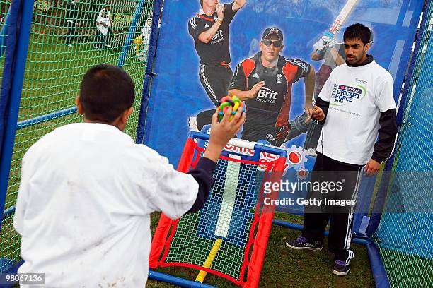 Boy throws the ball during the NatWest CricketForce at Harrow Saint Mary's Cricket Club on March 26, 2010 in London, England. 85,000 volunteers take...