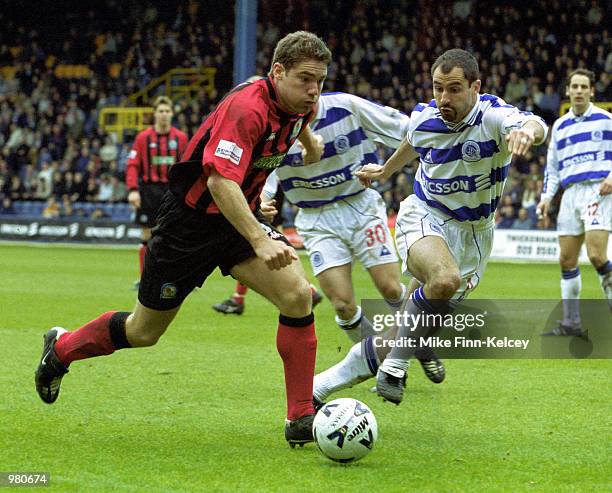 David Dunn of Blackburn tries to get past Gavin Peacock of QPR during the Queens Park Rangers v Blackburn Rovers Nationwide First Division match...