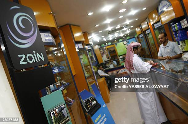 The logo of Kuwait's telecom company Zain is displayed at a store in Kuwait City on March 26, 2010. India's top mobile firm Bharti Airtel said on...