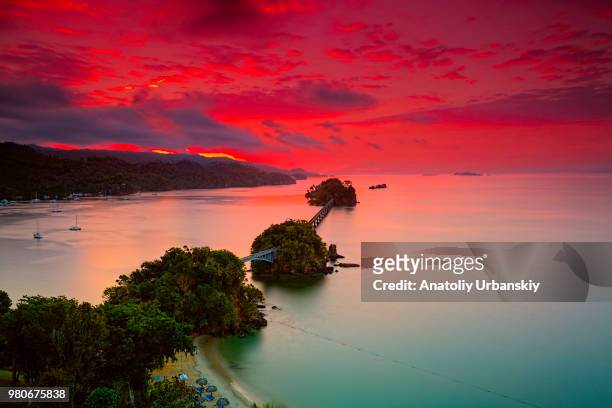 bridges over sea at sunrise, samana, dominican republic - domminican stock pictures, royalty-free photos & images