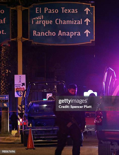 Police gather at an early morning murder, one of numerous murders over a 24 hour period, on March 26, 2010 in Juarez, Mexico. Secretary of State...