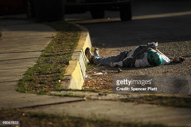 Body with a mask lies dead in the street, one of numerous murders over a 24 hour period, on March 26, 2010 in Juarez, Mexico. Secretary of State...
